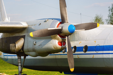 Engine and propeller of the old transport plane close-up. Fragment of the aircraft.