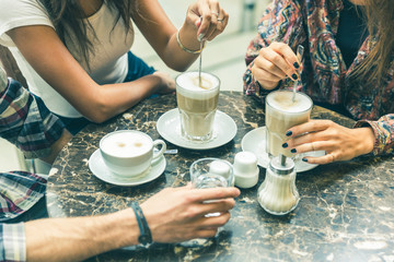 Multiracial group of friends having a coffee together
