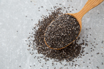 Chia seeds in a wooden spoon. Superfood, healthy concept
