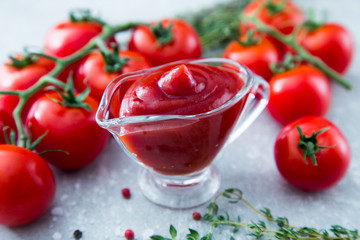 Tomato ketchup sauce with garlic, spices and herbs with cherry t