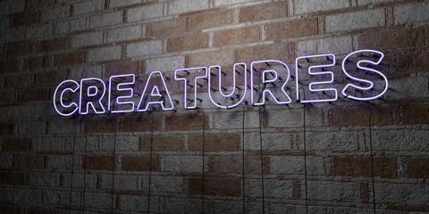 CREATURES - Glowing Neon Sign on stonework wall - 3D rendered royalty free stock illustration.  Can be used for online banner ads and direct mailers..