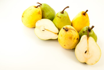green and yellow pears on white