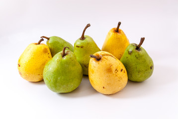 green and yellow pears on white
