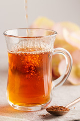 Glass cup of rooibos tea