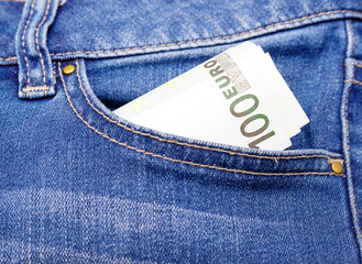 euro money in blue jeans pocket background
