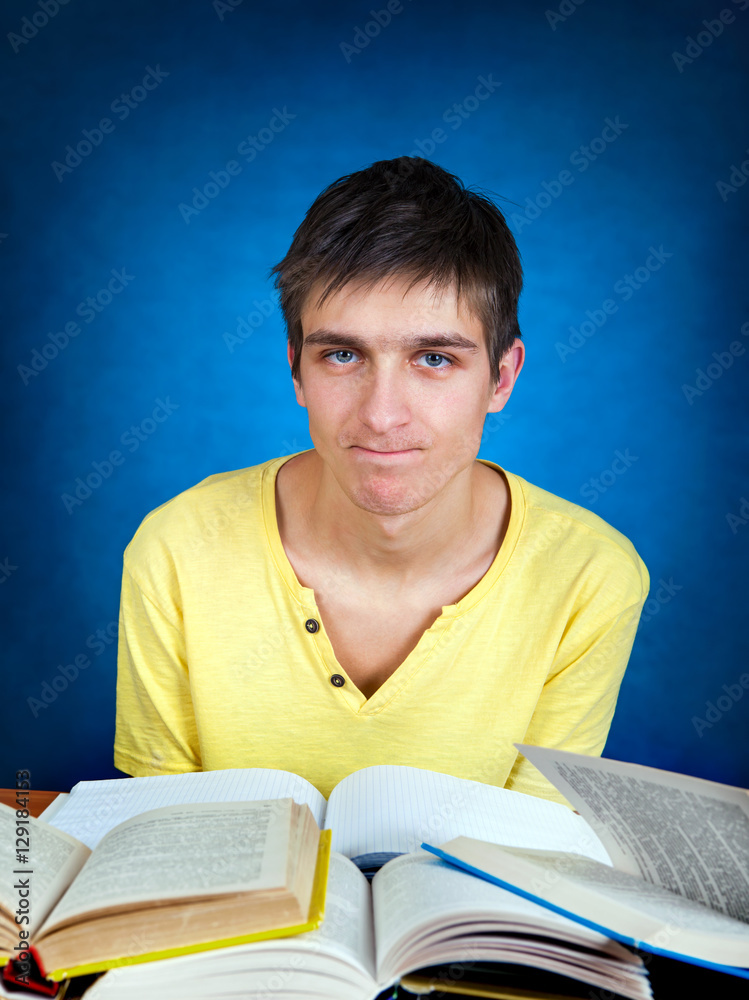 Wall mural annoyed student with a books