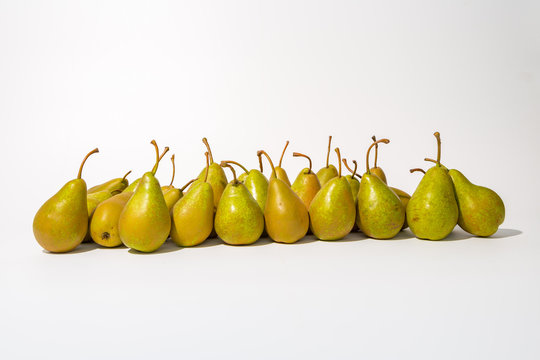 A bunch of green pears in a row