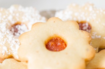 Homemade apricot jam Linzer with icing sugar close up