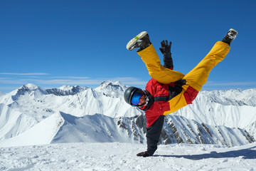 strong man in a sportswear stands on hands