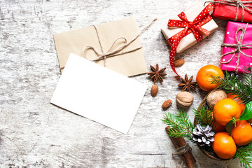 christmas greeting card with tangerines, spices and nuts