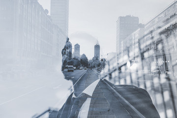 Half length double exposure portrait of young caucasian brown hair bearded man, and city...