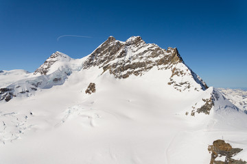 Fototapeta na wymiar Jungfraujoch or Jungfrau Top Of Europe, Swiss Alps range Scenic near Interlaken, Switzerland