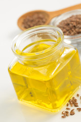 linseed oil in bottle isolated on white