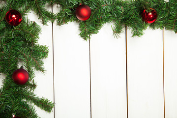 Christmas decoration, red toys on a white wooden background