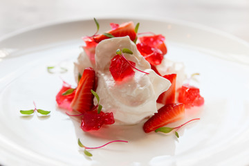 Merengue dessert with strawberries and jam