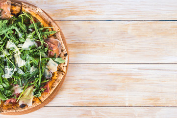Pizza on wooden background