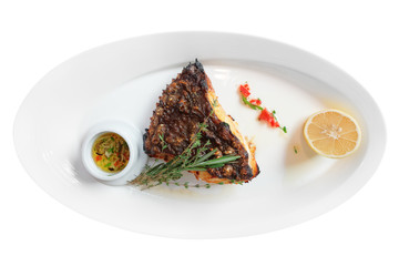 Grilled flounder on white plate, isolated