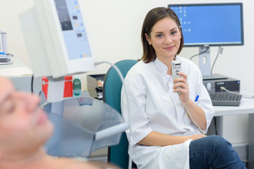 Portrait of nurse holding medical equipment