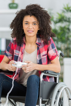 Disabled lady playing computer game