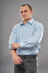 Businessman rolling up sleeves