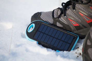 the solar battery on snow in a campaign is charged