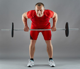 Man doing workout with barbell