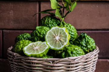 Kaffir lime in the basket  .tropical herb fruit for  ingredient