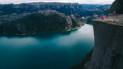couple in love Preikestolen massive cliff (Norway, Lysefjorden s