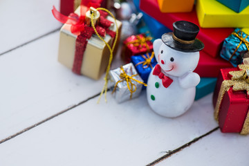 Snowman on wooden table. Christmas decoration.