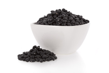 Fototapeta na wymiar Black turtle beans in a bowl isolated on white background