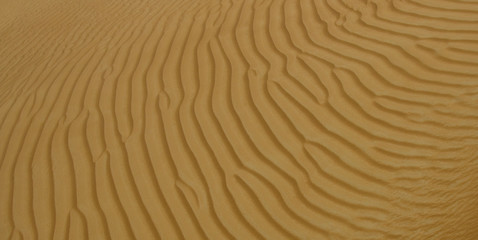 Fototapeta na wymiar Sand patterns at a desert in Dubai, UAE