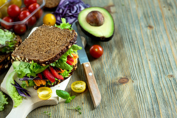 Vegan rye wholegrain fresh sandwich with ingredients for healthy meal, vitamin and diet food - 129200559