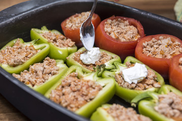 Peppers and tomatoes stuffed with meat