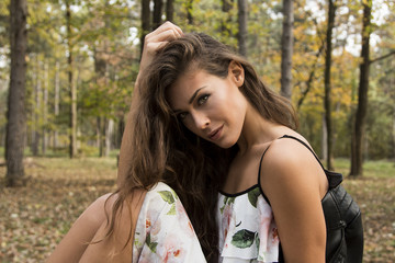 Naklejka premium Beautiful girl in dress in autumn forest