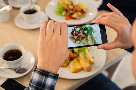 Close-up Man's hands Taking Picture Of Food With Mobile smart Phone