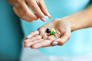 Vitamins And Supplements. Female Hand Holding Colorful Pills - obrazy, fototapety, plakaty