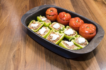 Peppers and tomatoes stuffed with meat
