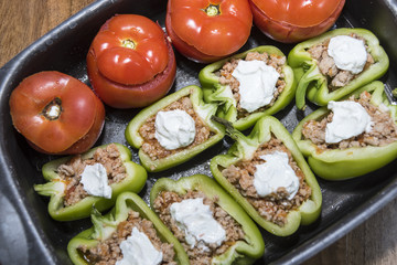 Peppers and tomatoes stuffed with meat