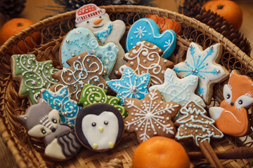 Christmas gingerbread cookies with  tangerines on red background