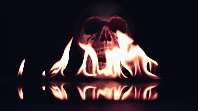 4k Halloween Shot of Skull Burning in Fire Flames