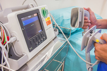 EKG or ECG monitor and patient bed in the hospital