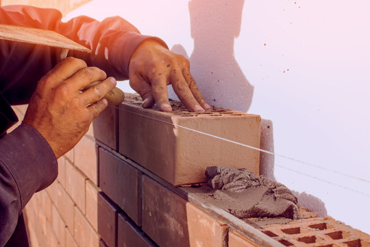 Bricklaying, construction work, manual labor.