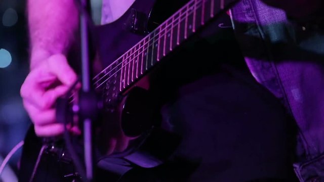 Guitarist on stage in night club