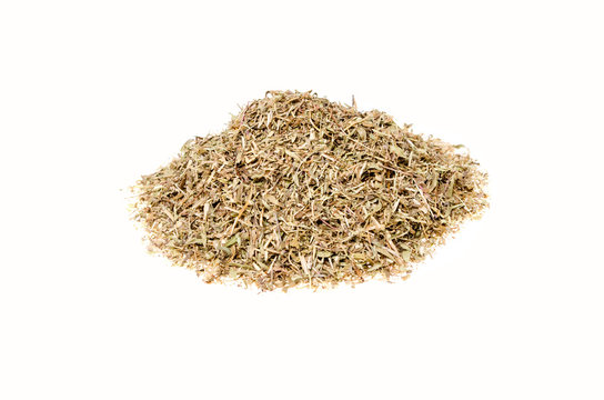 dry chopped herbs of thyme on a white background