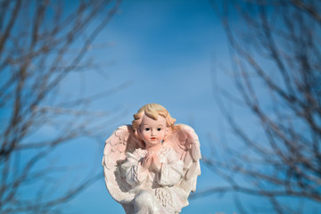 angel on background of blue sky