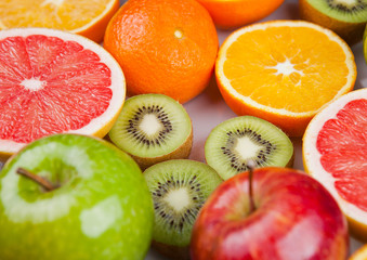 Naklejka na ściany i meble Fruits mix grapefruit orange apples and kiwi