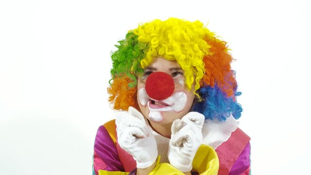 Portrait of dancing clown against white background