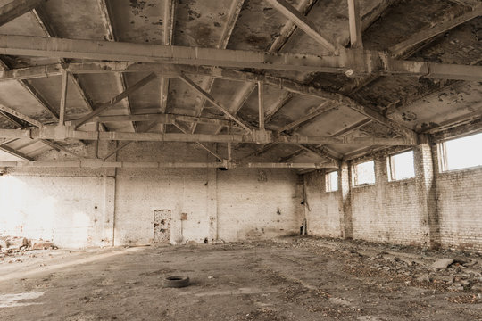 abandoned building. destroyed a military base. large hangar. garage for automotive equipment. ruined building
