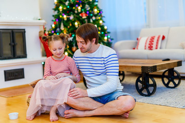 Family at home decorated for Christmas