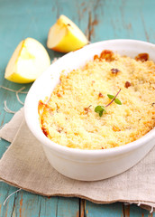 crumble with apples in white dish